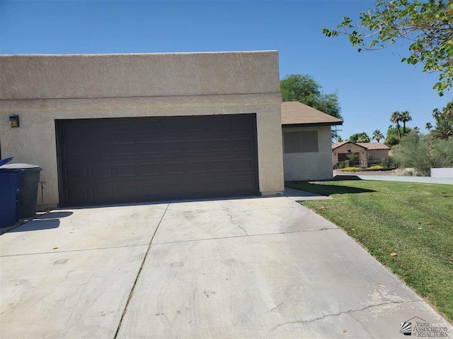 garage with a lawn