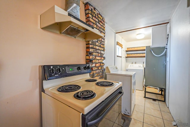 kitchen with light tile patterned floors, extractor fan, range with electric cooktop, and washing machine and clothes dryer