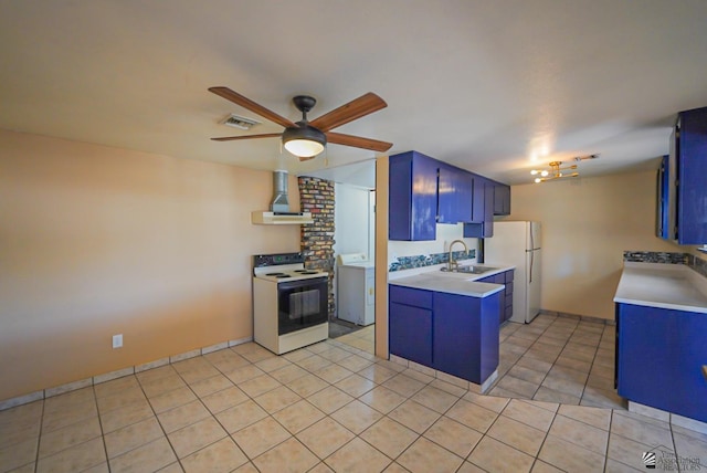 kitchen with blue cabinets, white appliances, light countertops, and wall chimney range hood