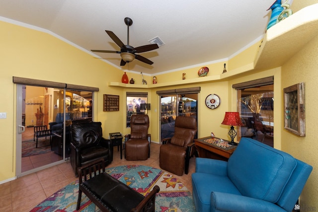 tiled living room featuring vaulted ceiling, ornamental molding, and ceiling fan