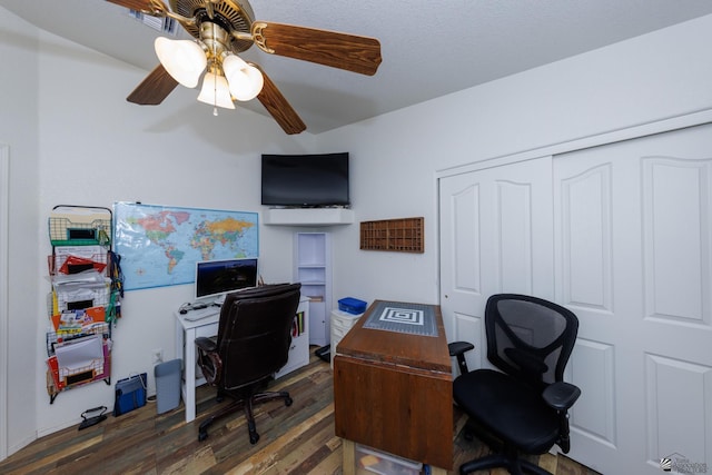 office space with dark hardwood / wood-style floors and ceiling fan