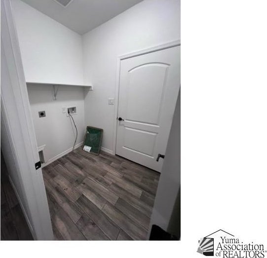 clothes washing area featuring dark wood-type flooring, washer hookup, and hookup for an electric dryer