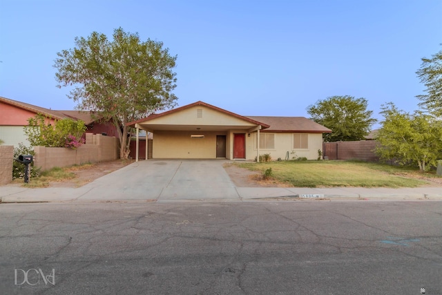 single story home with a front lawn and a carport