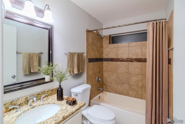 full bathroom featuring vanity, toilet, and shower / tub combo