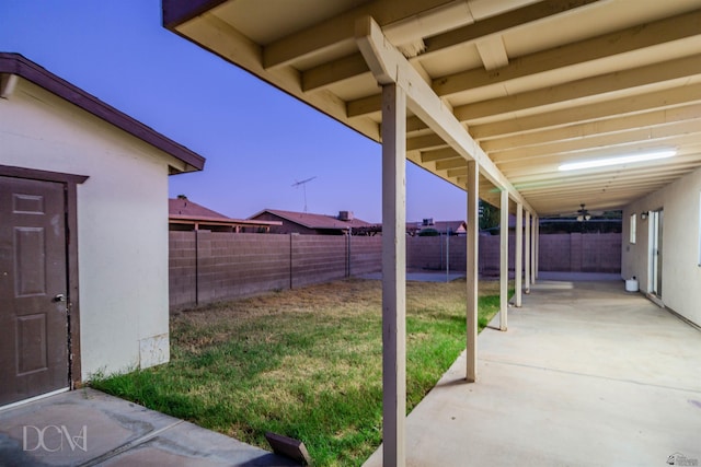 exterior space featuring ceiling fan