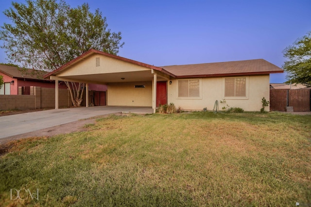 ranch-style house with a carport and a front yard