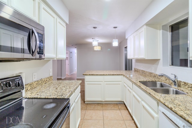 kitchen with pendant lighting, kitchen peninsula, sink, black electric range, and white cabinetry