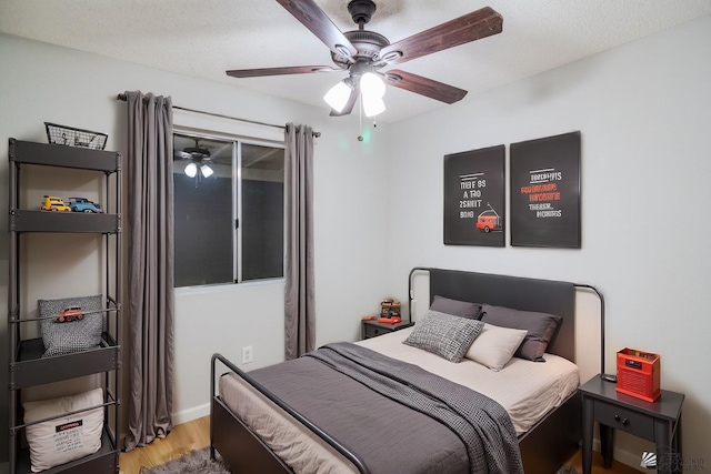 bedroom featuring ceiling fan and light wood-type flooring