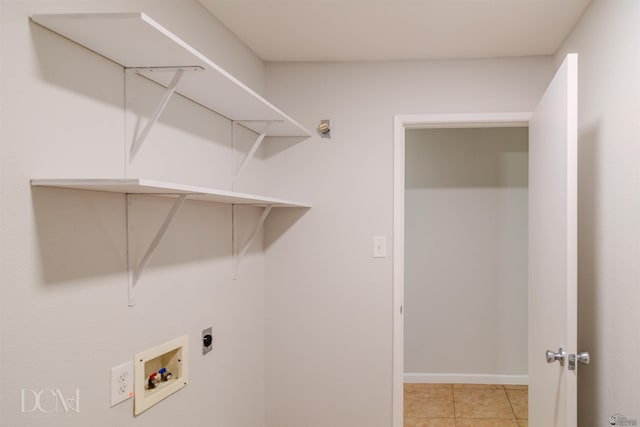 washroom with hookup for a washing machine, light tile patterned floors, and electric dryer hookup