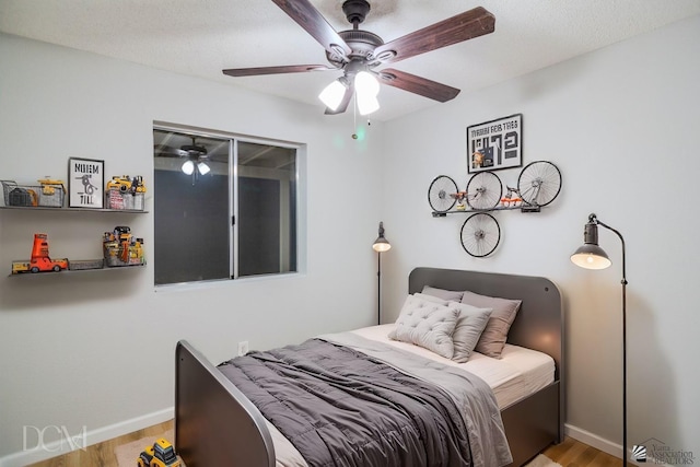 bedroom featuring ceiling fan and light hardwood / wood-style floors