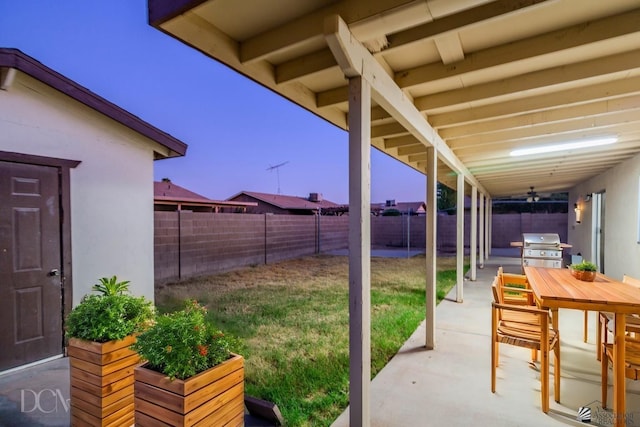 view of patio / terrace featuring ceiling fan and a grill