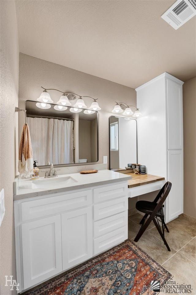 bathroom featuring vanity and tile patterned floors