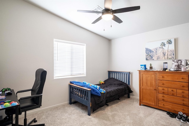 bedroom with a ceiling fan, lofted ceiling, light carpet, and baseboards