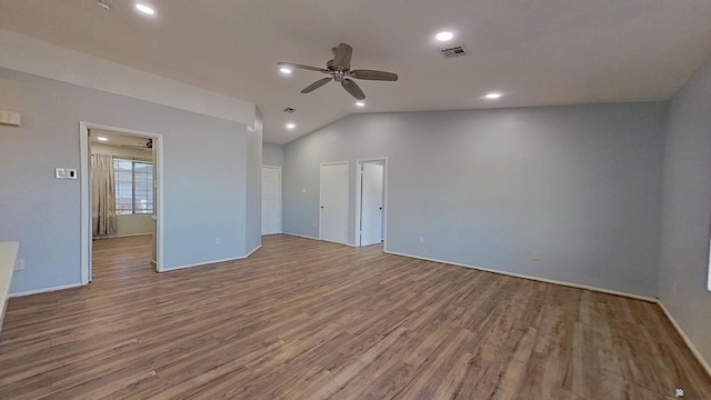 unfurnished room featuring lofted ceiling, recessed lighting, visible vents, ceiling fan, and wood finished floors