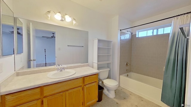 full bath featuring a ceiling fan, toilet, tile patterned flooring, shower / bath combo with shower curtain, and vanity