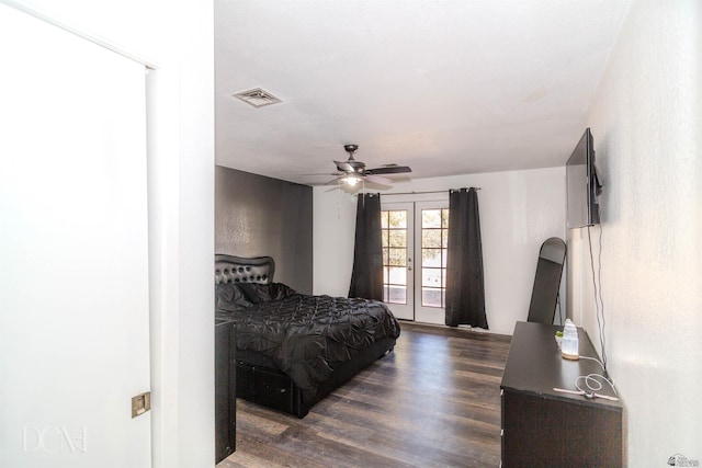 bedroom with french doors, dark wood-style flooring, visible vents, and a ceiling fan