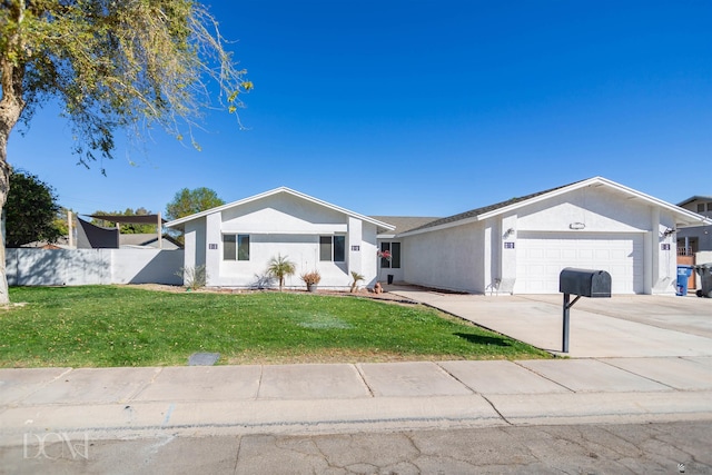 ranch-style home featuring a garage, driveway, fence, a front lawn, and stucco siding