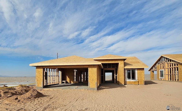 unfinished property featuring a water view