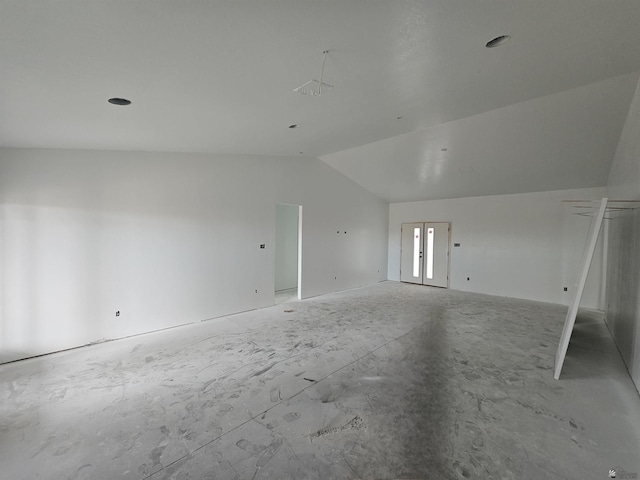 spare room featuring vaulted ceiling