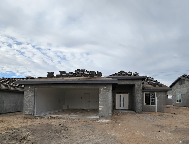 property under construction with a patio area and stucco siding