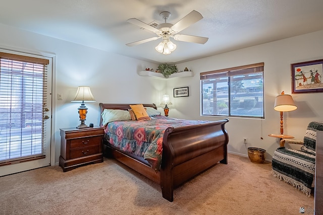 bedroom featuring light colored carpet and ceiling fan