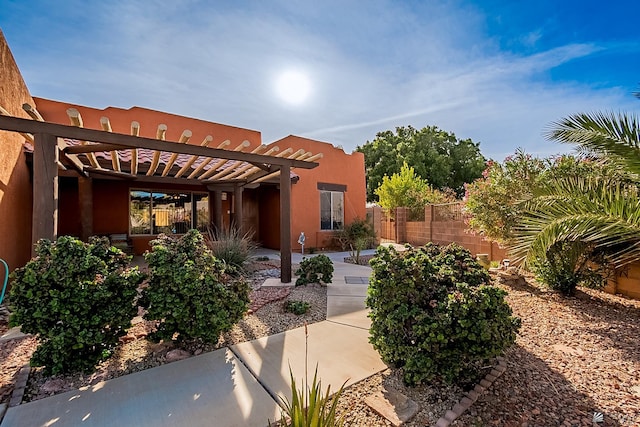 exterior space featuring a patio and a pergola