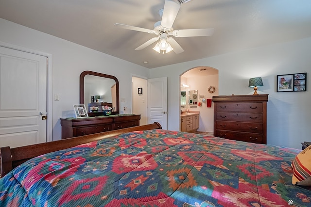 bedroom featuring ceiling fan and connected bathroom