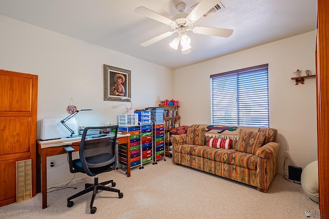 home office featuring ceiling fan and light colored carpet