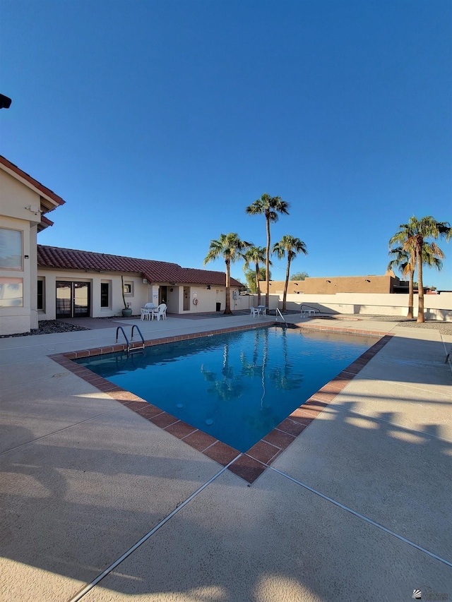 pool featuring a patio area