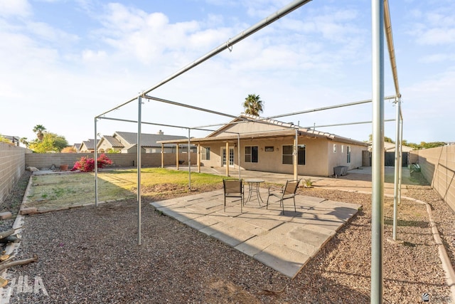 back of house featuring a patio