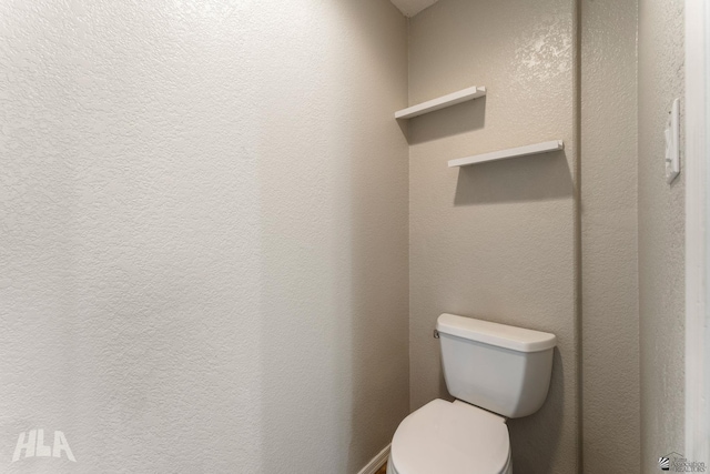 bathroom featuring toilet