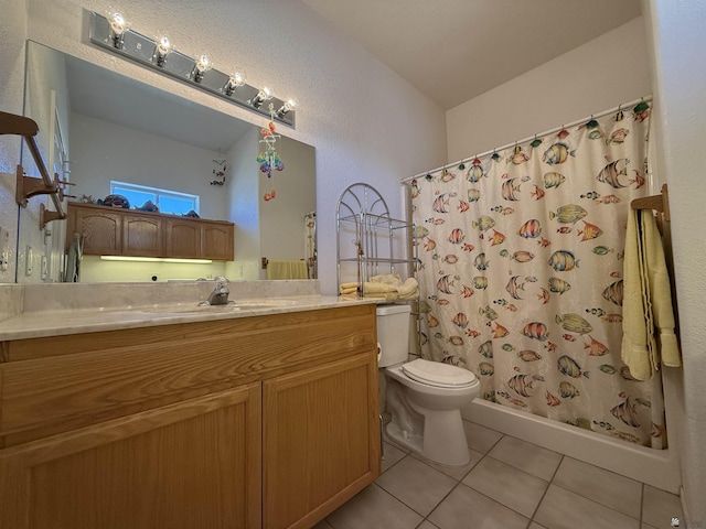 bathroom with curtained shower, tile patterned flooring, vanity, and toilet