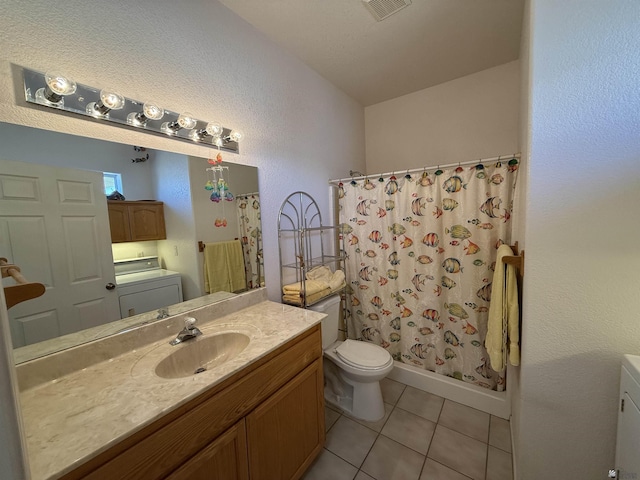 bathroom with tile patterned flooring, vanity, and toilet