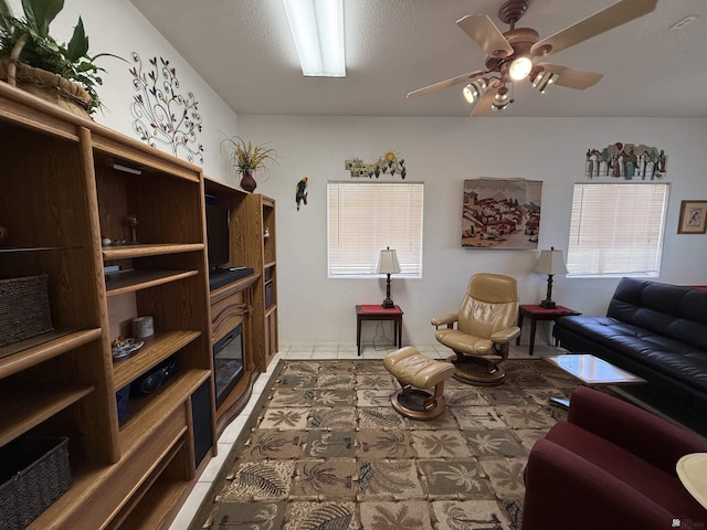 interior space featuring a textured ceiling and ceiling fan