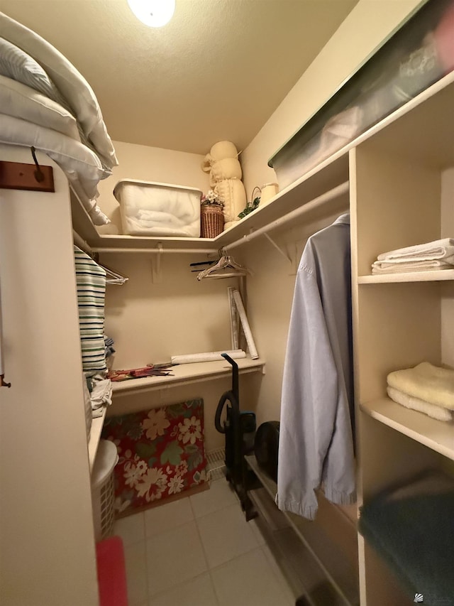 walk in closet featuring light tile patterned floors