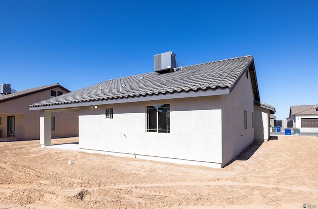 back of property with central AC unit