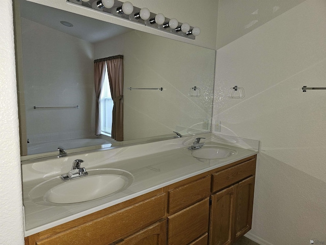 bathroom featuring a bathing tub and vanity