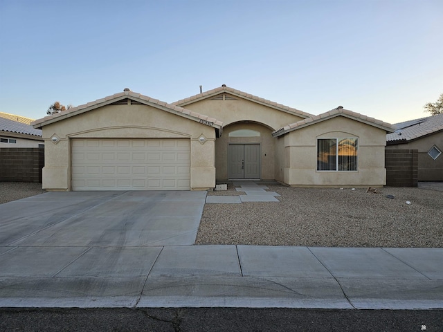 ranch-style home featuring a garage