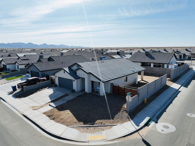 birds eye view of property featuring a residential view and a mountain view