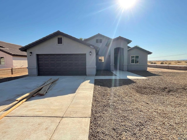 view of front of property with a garage