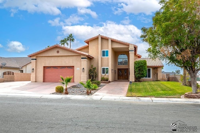 view of front of house with a garage and a front lawn