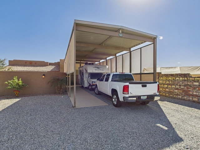 view of parking / parking lot with fence