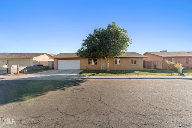 single story home featuring a garage