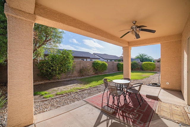 view of patio featuring ceiling fan