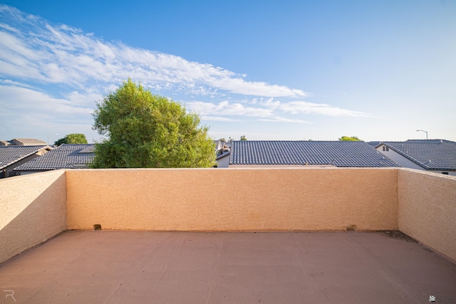 view of patio featuring a balcony