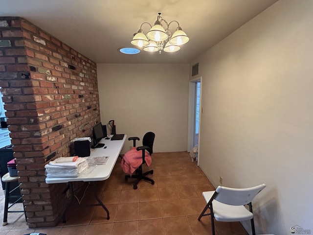 office space featuring tile patterned floors and an inviting chandelier