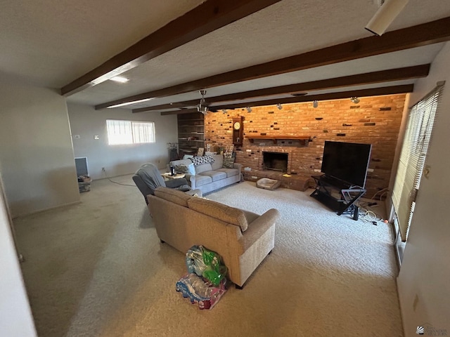 living room featuring beam ceiling, carpet floors, a textured ceiling, and a brick fireplace