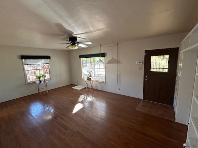 foyer entrance featuring ceiling fan and dark hardwood / wood-style flooring