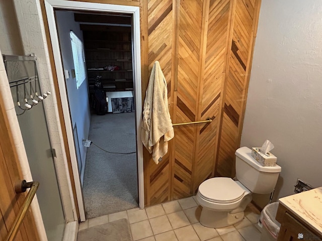 bathroom featuring tile patterned floors, vanity, and toilet