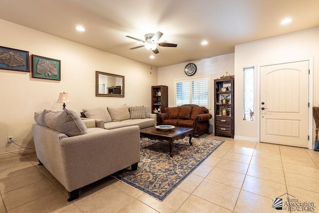 living room with ceiling fan and light tile patterned floors